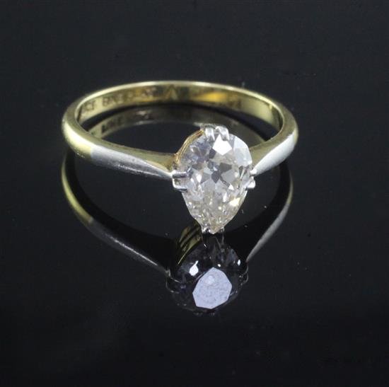 An 18ct gold and platinum, pear shaped solitaire diamond ring, size P.